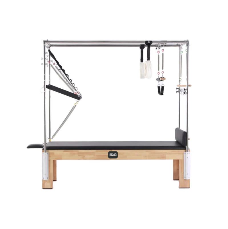 The Echo Kodiak Echo Pilates Cadillac Reformer Vintage features a solid oak frame with metal bars, springs, and straps.